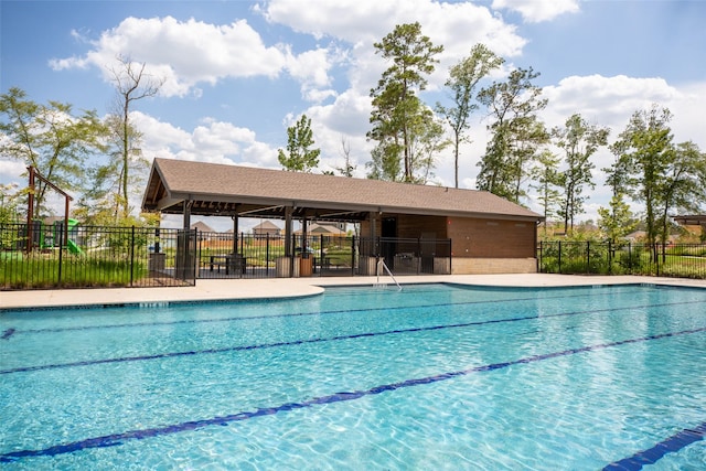 community pool featuring fence