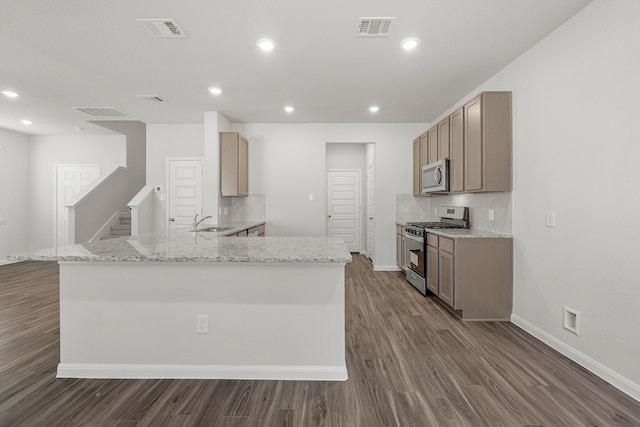 kitchen featuring a sink, dark wood-style floors, visible vents, and appliances with stainless steel finishes