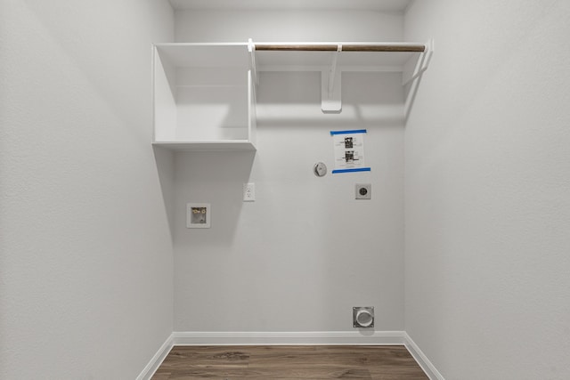 washroom featuring laundry area, hookup for an electric dryer, dark wood-style flooring, hookup for a gas dryer, and washer hookup