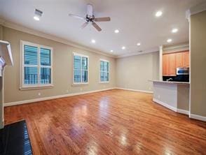unfurnished living room with recessed lighting, baseboards, ceiling fan, crown molding, and wood finished floors