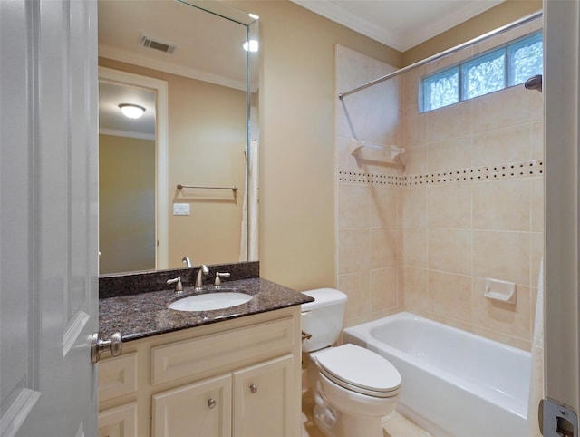 bathroom featuring toilet, ornamental molding, vanity, and visible vents