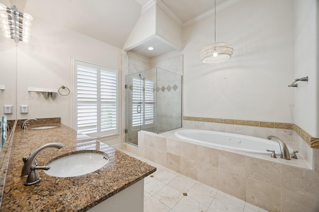 full bath with a sink, a shower stall, and a bath