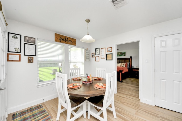 11202 Leah Elizabeth Dr, Needville, TX 77461 - dining space featuring light wood-type flooring and baseboards