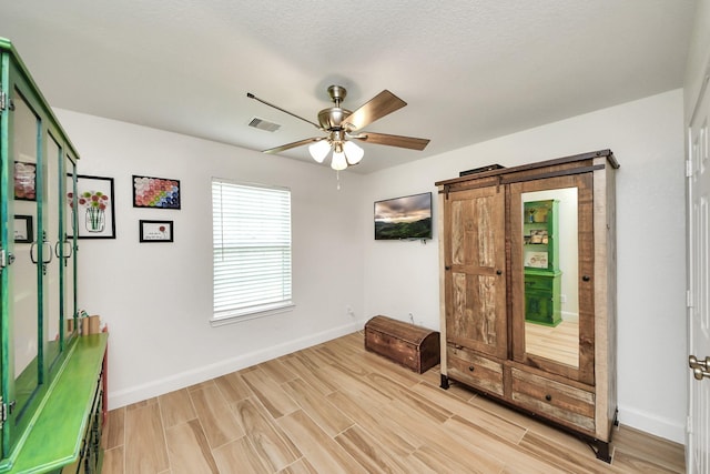 11202 Leah Elizabeth Dr, Needville, TX 77461 - unfurnished room featuring ceiling fan, baseboards, and light wood-style flooring