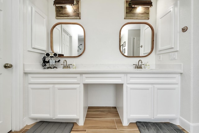 11202 Leah Elizabeth Dr, Needville, TX 77461 - bathroom featuring double vanity and wood finished floors