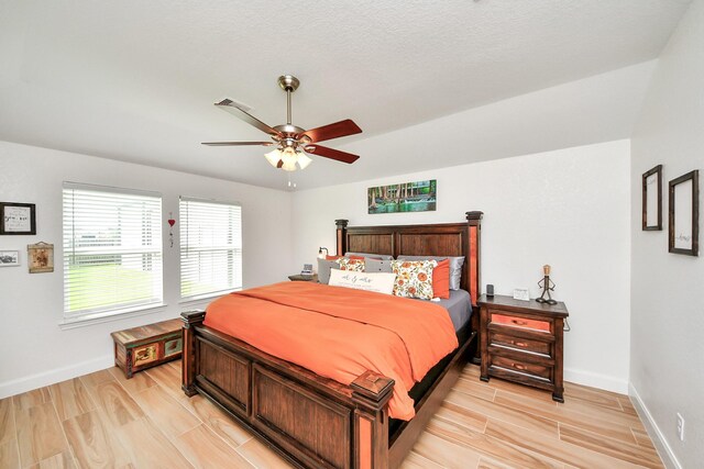 11202 Leah Elizabeth Dr, Needville, TX 77461 - bedroom featuring baseboards, light wood finished floors, and ceiling fan