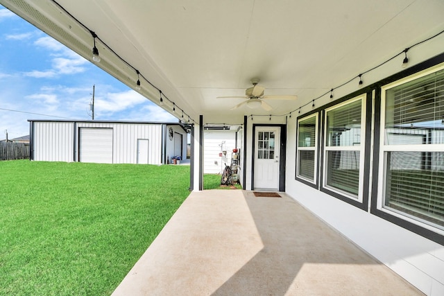 11202 Leah Elizabeth Dr, Needville, TX 77461 - view of patio / terrace with a ceiling fan and an outdoor structure