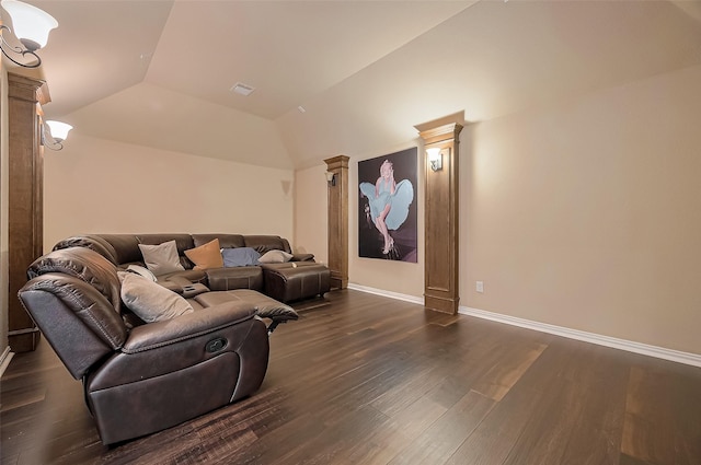 17019 Mahogany Trace Ln, Richmond, TX 77407 - living room featuring ornate columns, visible vents, dark wood-style flooring, baseboards, and vaulted ceiling