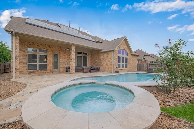 17019 Mahogany Trace Ln, Richmond, TX 77407 - view of swimming pool featuring a pool with connected hot tub, a patio, and a fenced backyard