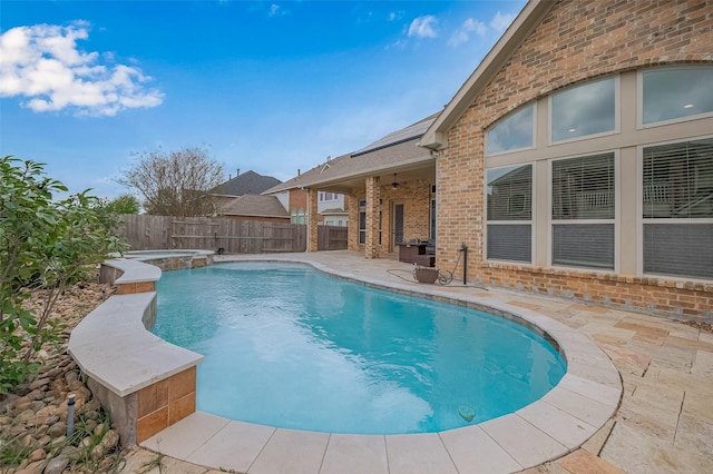 17019 Mahogany Trace Ln, Richmond, TX 77407 - view of pool featuring a fenced backyard, a patio, and a pool with connected hot tub