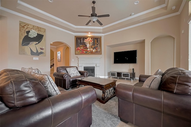 17019 Mahogany Trace Ln, Richmond, TX 77407 - carpeted living area featuring a raised ceiling, arched walkways, and a ceiling fan