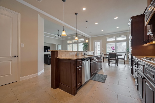17019 Mahogany Trace Ln, Richmond, TX 77407 - kitchen featuring a ceiling fan, ornamental molding, a sink, dark brown cabinetry, and appliances with stainless steel finishes