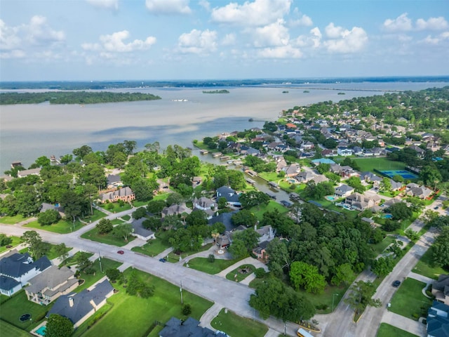 birds eye view of property with a water view and a residential view