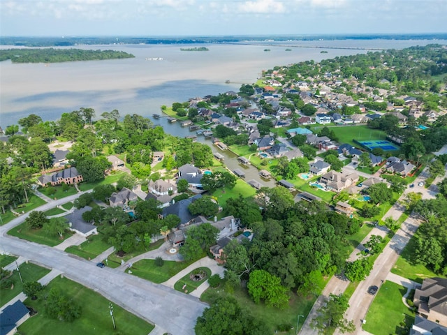 birds eye view of property featuring a water view and a residential view
