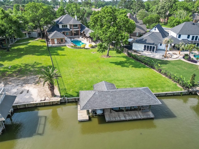 bird's eye view featuring a water view and a residential view