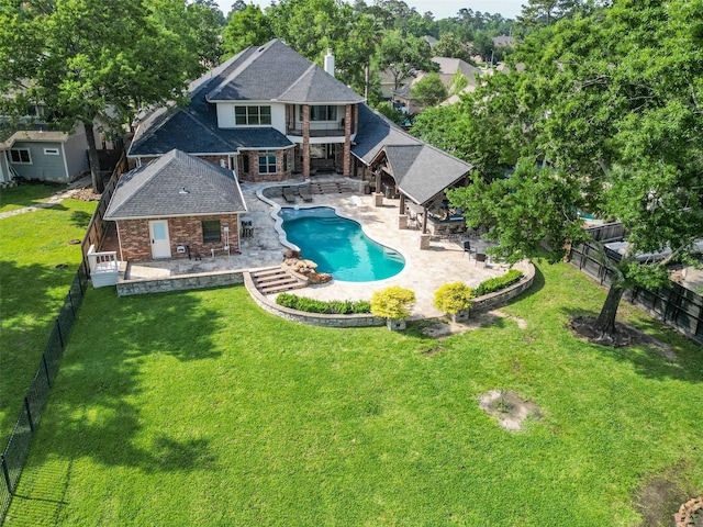 view of swimming pool featuring outdoor dining space, a lawn, a fenced backyard, a patio area, and a fenced in pool