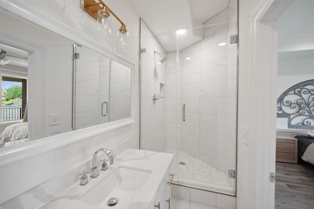 full bathroom featuring vanity, connected bathroom, and a stall shower