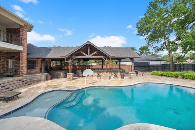 view of swimming pool featuring a hot tub, a fenced in pool, a patio area, a gazebo, and a fenced backyard