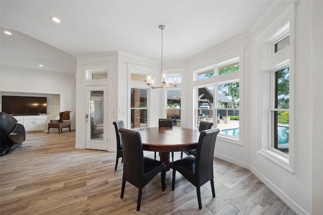 dining area featuring light wood-style floors, a chandelier, a healthy amount of sunlight, and recessed lighting