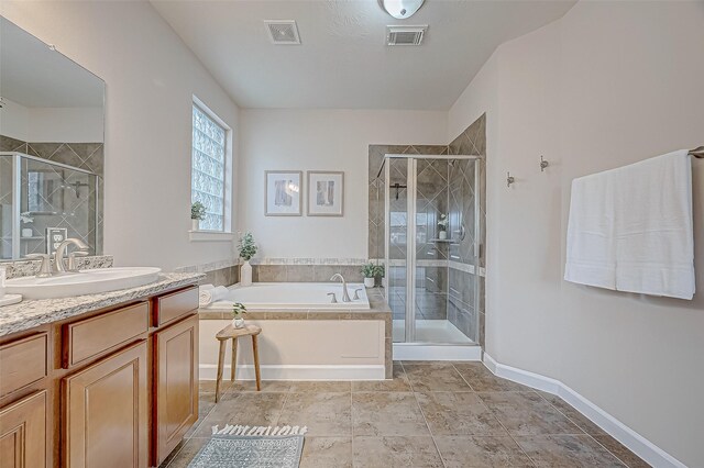 full bathroom with a stall shower, vanity, visible vents, and a bath