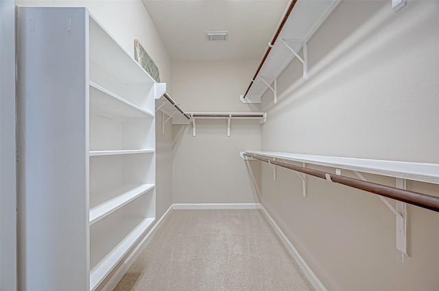 spacious closet featuring carpet and visible vents