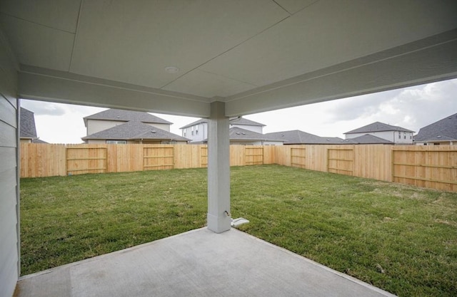 view of yard with a patio area and a fenced backyard