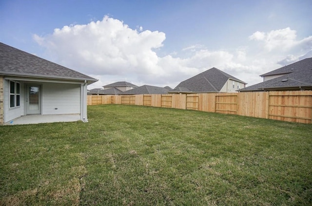 view of yard featuring a patio area and a fenced backyard
