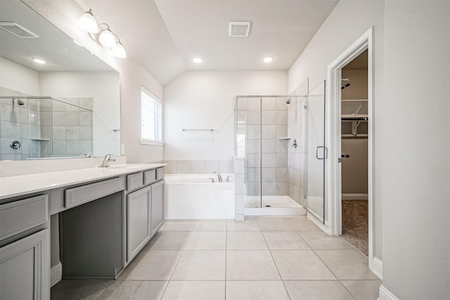 bathroom featuring a shower stall, tile patterned floors, and visible vents