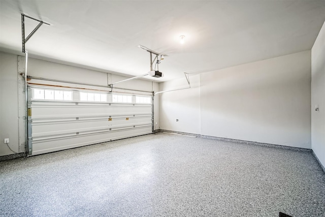 garage featuring baseboards and a garage door opener