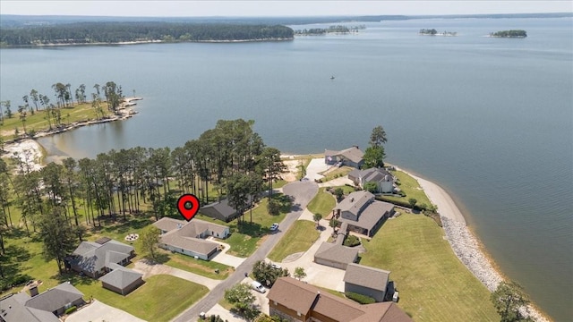 bird's eye view featuring a water view and a residential view
