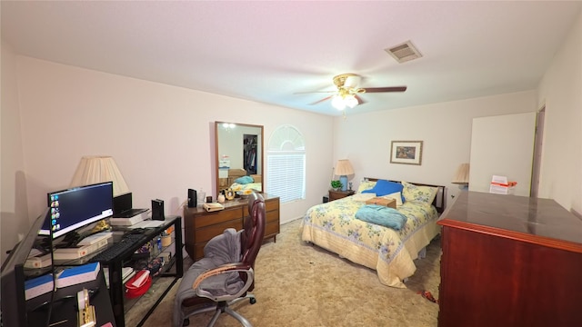 bedroom featuring visible vents, ceiling fan, and carpet floors