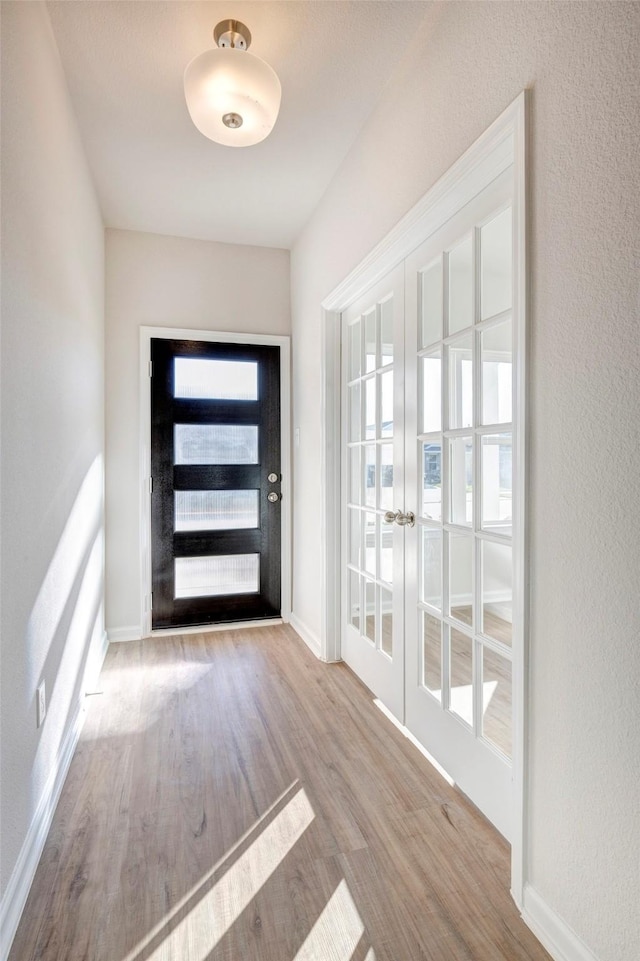 805 Apple Blossom Dr, La Marque, TX 77568 - entryway featuring french doors, wood finished floors, and baseboards