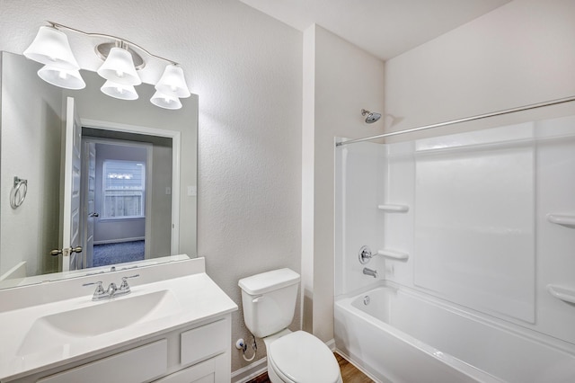 805 Apple Blossom Dr, La Marque, TX 77568 - bathroom with toilet, baseboards, shower / tub combination, vanity, and a textured wall