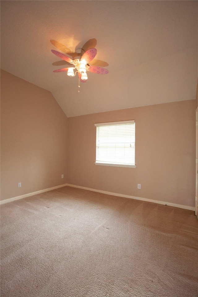 13847 Ventura Rd, Willis, TX 77318 - spare room featuring ceiling fan, lofted ceiling, carpet flooring, and baseboards