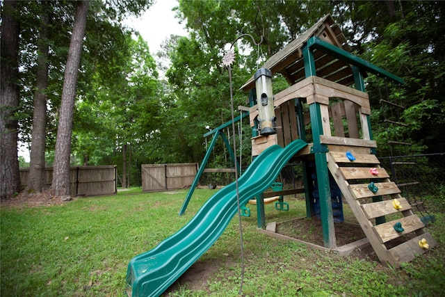 13847 Ventura Rd, Willis, TX 77318 - view of play area featuring a yard and fence