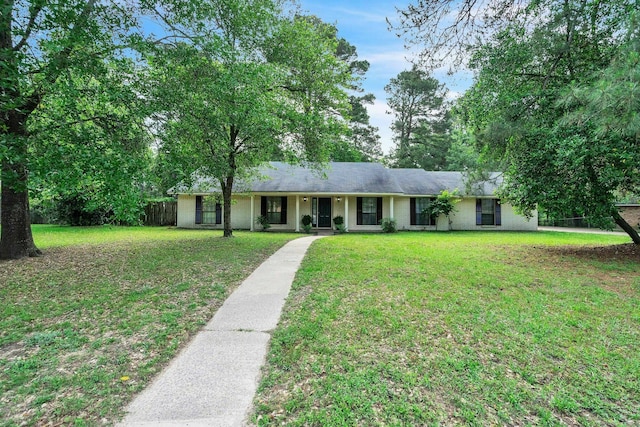 4308 Red Oak Dr, Nacogdoches, TX 75965 - ranch-style house with brick siding, a front lawn, and fence