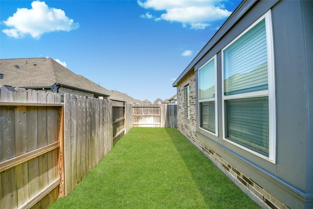 view of yard featuring a fenced backyard