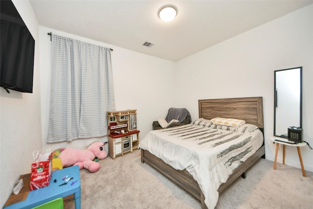 bedroom featuring baseboards and carpet floors