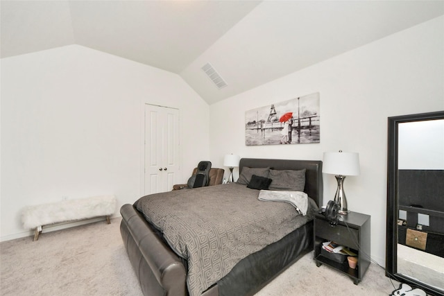 bedroom with carpet flooring, visible vents, and lofted ceiling