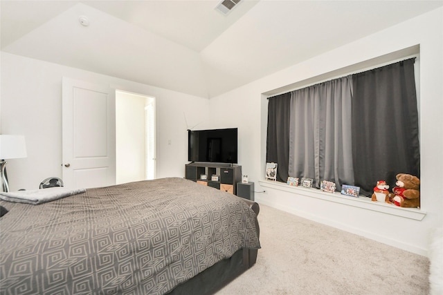bedroom featuring vaulted ceiling, carpet, and visible vents