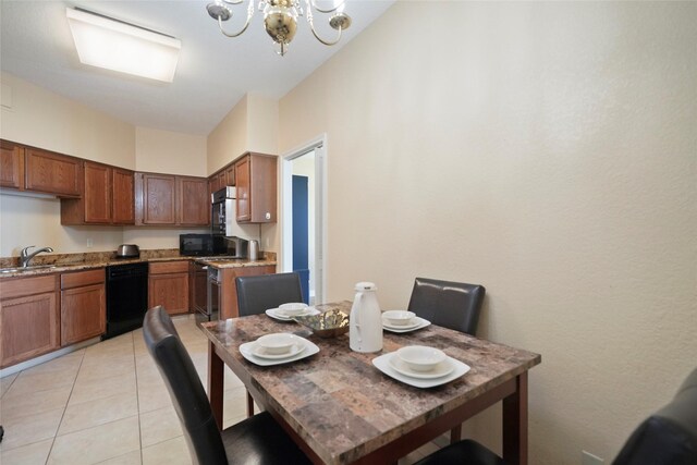 dining room featuring a chandelier and light tile patterned floors