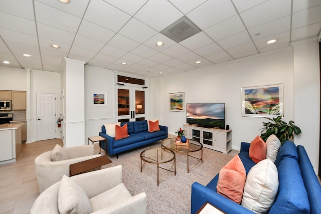 living room featuring recessed lighting and french doors