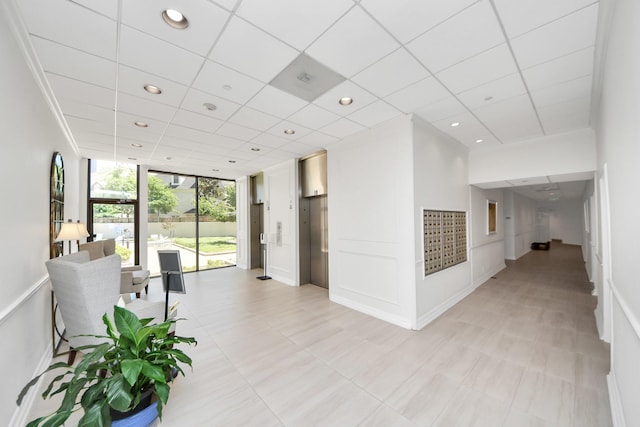 building lobby featuring a wall of windows and recessed lighting