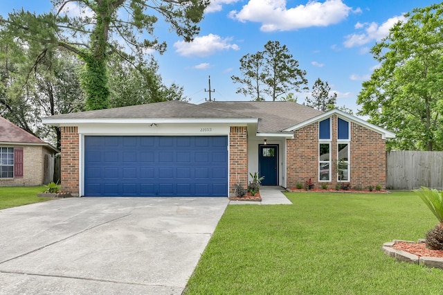 22603 Pebworth Pl, Spring, TX 77373 - view of front of home featuring concrete driveway, an attached garage, and brick siding