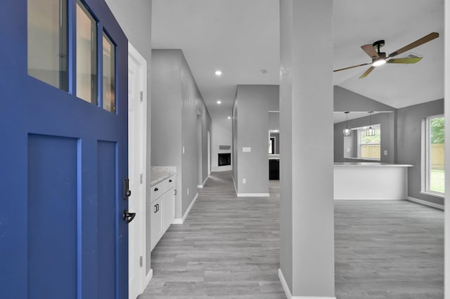 22603 Pebworth Pl, Spring, TX 77373 - foyer entrance with ceiling fan, light wood-style flooring, baseboards, recessed lighting, and lofted ceiling