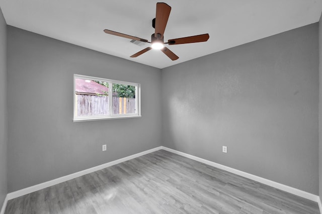 22603 Pebworth Pl, Spring, TX 77373 - spare room with a ceiling fan, wood finished floors, and baseboards