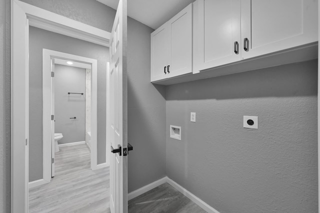 22603 Pebworth Pl, Spring, TX 77373 - laundry room featuring electric dryer hookup, cabinet space, light wood-type flooring, hookup for a washing machine, and baseboards