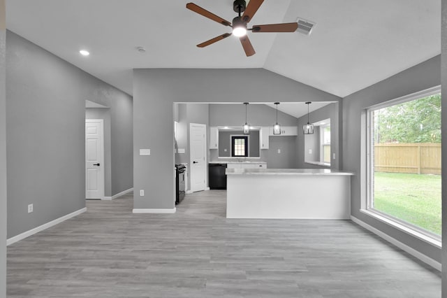 22603 Pebworth Pl, Spring, TX 77373 - kitchen with vaulted ceiling, a peninsula, ceiling fan, white cabinetry, and black appliances