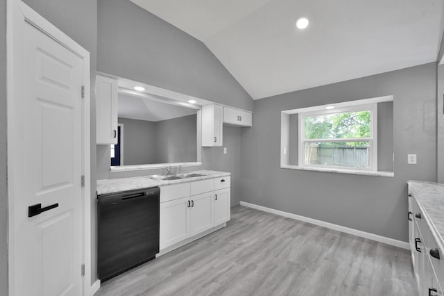 22603 Pebworth Pl, Spring, TX 77373 - kitchen with black dishwasher, a sink, vaulted ceiling, white cabinets, and light wood finished floors