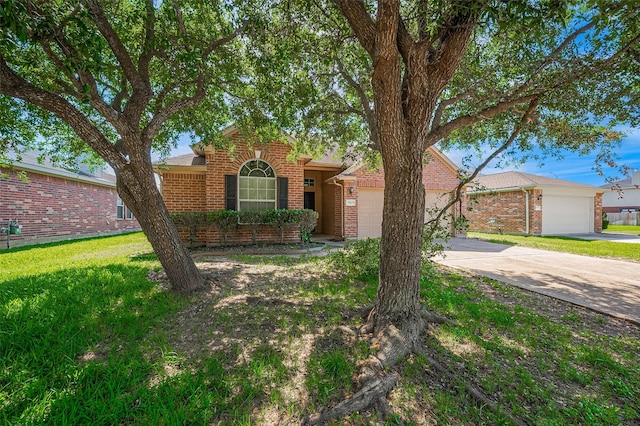 ranch-style house with concrete driveway, a front lawn, brick siding, and an attached garage